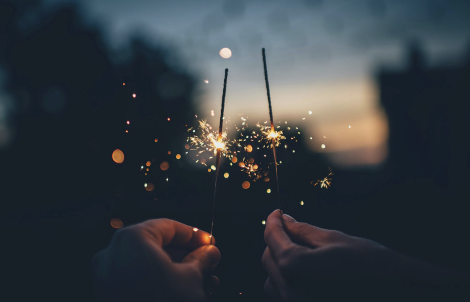 Sparklers bring people into the new year. 